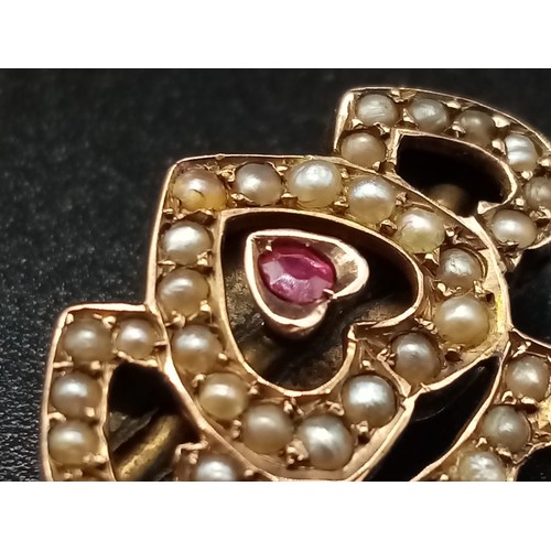 1173 - A REGAL STYLE GOLD , BURMESE RUBY AND PEARL BROOCH POSSIBLY RUSSIAN . 2.58gms (one stone missing)