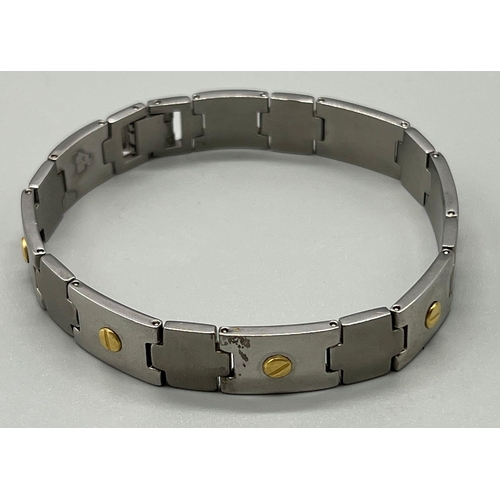 963 - A Stainless Steel Bracelet with 18K Yellow Gold Small Studs. 20cm. 44.72g total weight.