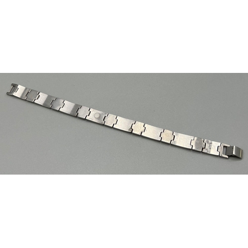 963 - A Stainless Steel Bracelet with 18K Yellow Gold Small Studs. 20cm. 44.72g total weight.