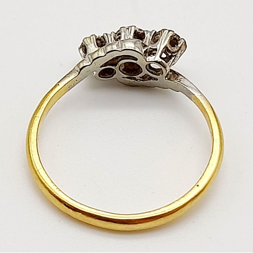 712 - An 18k Yellow Gold and Platinum Diamond Crossover Ring. Size P. 2.88g total weight.