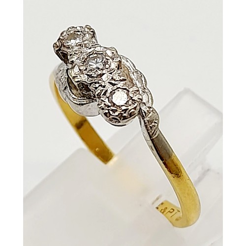 712 - An 18k Yellow Gold and Platinum Diamond Crossover Ring. Size P. 2.88g total weight.