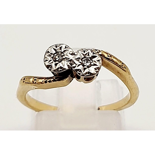 698 - A 9K Yellow Gold Two Diamond Crossover Ring. Size M.
2.39g total weight.