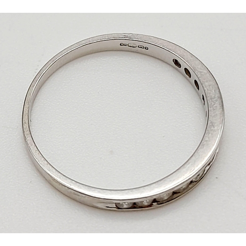 919 - A 9K White Gold Diamond Half Eternity Ring. Size J.
1.12g total weight.