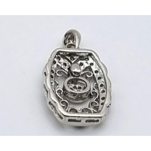 758 - 14K WHITE GOLD DIAMOND SET PENDANT. 2.9G. 0.20CT APPROX. 20MM.