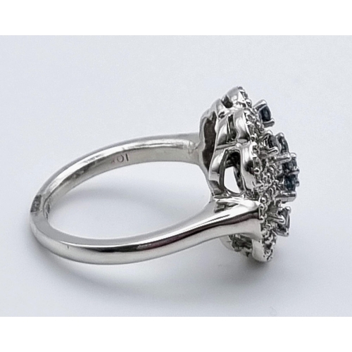 898 - 10K WHITE GOLD DIAMOND SET FLOWER CLUSTER RING. SIZE N. 0.45CT. 6G.