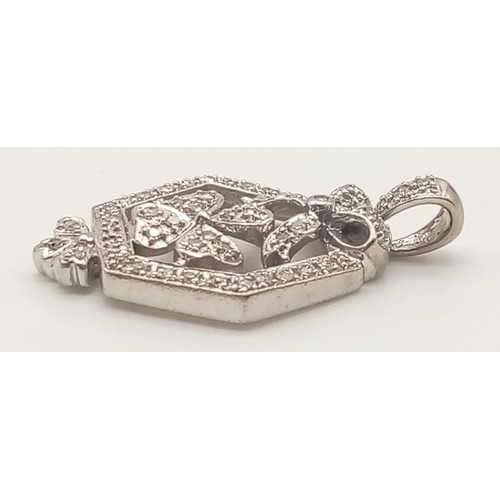 884 - 14K WHITE GOLD DIAMOND SET FANCY PENDANT. 0.30CT APPROX OF DIAMONDS. TOTAL WEIGHT 3.4 GRAMS