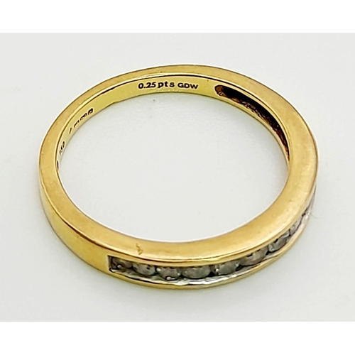 822 - AN 18K GOLD HALF ETERNITY RING WITH .25CT CHANNEL SET DIAMONDS.  2.1gms  size K