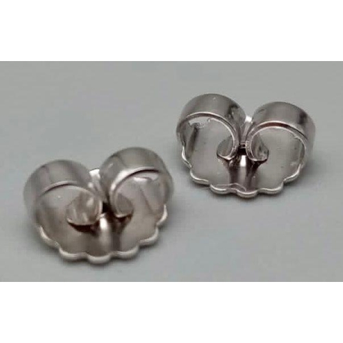 941 - A PAIR OF TIFFANY & CO 18K WHITE GOLD EARRING BUTTERFLY BACKS.  1.5gms