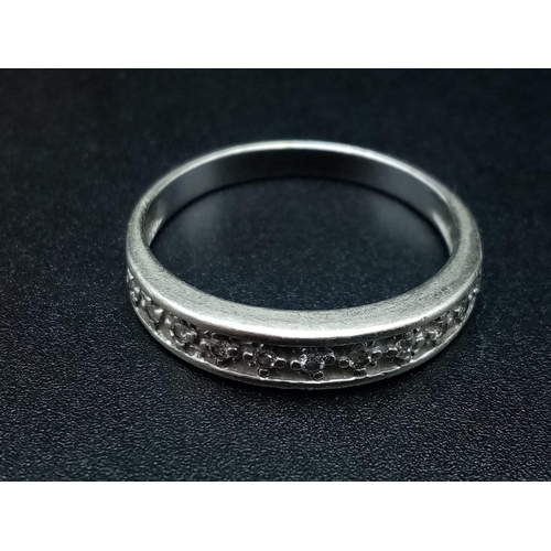 969 - A 9K White Gold Diamond Half Eternity Ring. 0.10ct. 
Size O. 2g