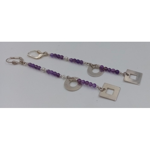 662 - A PAIR OF SILVER AND AMETHYST DROP EARRINGS. 5.4gms