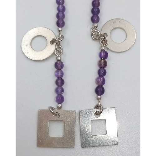 662 - A PAIR OF SILVER AND AMETHYST DROP EARRINGS. 5.4gms