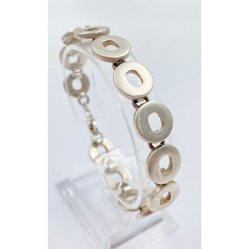 675 - Sterling silver fancy round link bracelet, approx. 19cm in length, total weight 33.1 grams