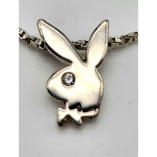 618 - STERLING SILVER PLAYBOY PENDANT ON CHAIN. 4.5G.
40CM