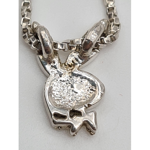 618 - STERLING SILVER PLAYBOY PENDANT ON CHAIN. 4.5G.
40CM