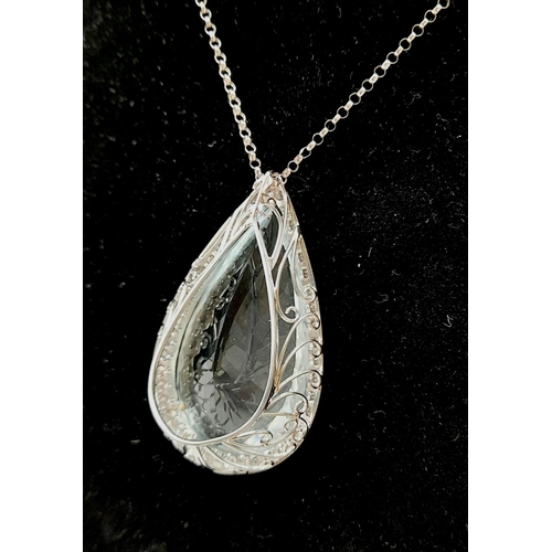 310 - A Large Flawless 62ct Aquamarine Teardrop-Cut Diamond Surround Pendant 18K White gold Pendant. On an... 