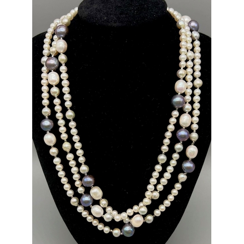 324 - A Natural Blue and White South Sea Pearl Rope Necklace. Length 150cm. 103g total weight.