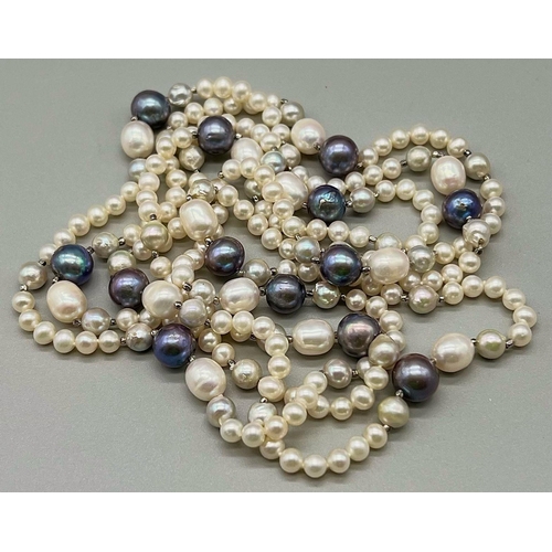 324 - A Natural Blue and White South Sea Pearl Rope Necklace. Length 150cm. 103g total weight.