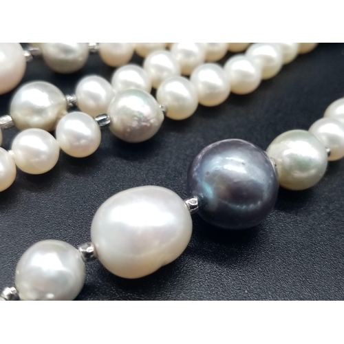 324 - A Natural Blue and White South Sea Pearl Rope Necklace. Length 150cm. 103g total weight.