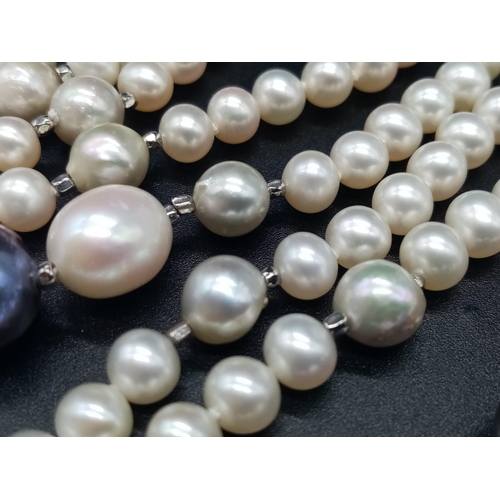 324 - A Natural Blue and White South Sea Pearl Rope Necklace. Length 150cm. 103g total weight.