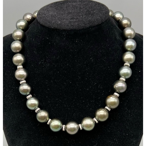 508 - An 18K White Gold Tahitian Grey Pearl Choker Necklace. Gold glitter ball clasp and spacer beads. Pea... 