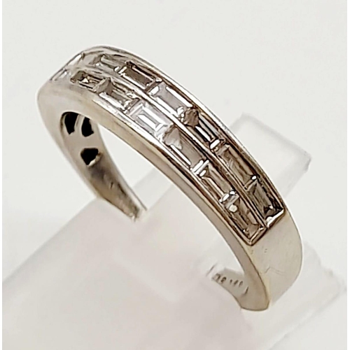 514 - An 18K White Gold Diamond Half Eternity Ring. 14 small baguette cut diamonds. Size N. 4.43g