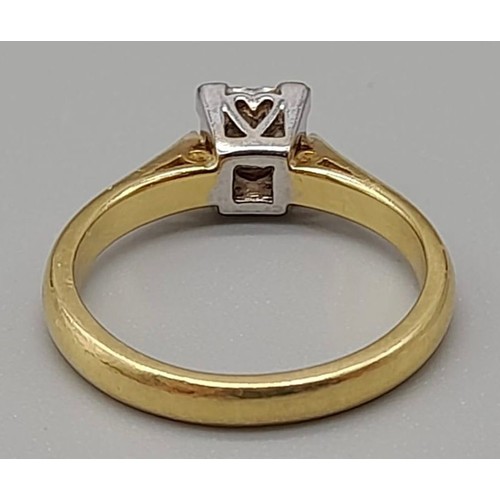 535 - An 18K Yellow Gold Diamond Solitaire Ring. 0.5ct. Round-cut diamond in a square heart setting. Size ... 