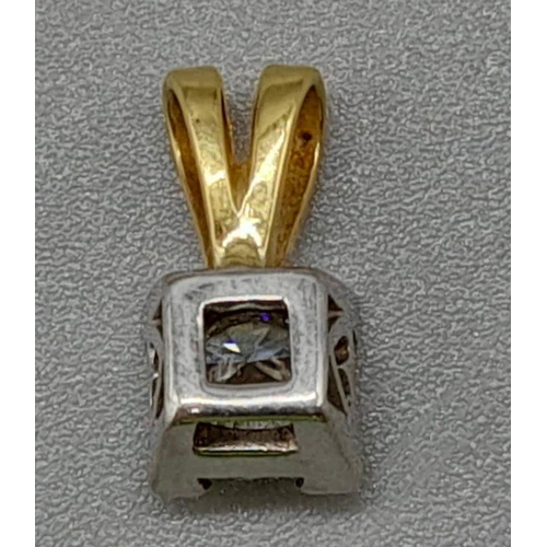 412 - An 18K Gold and Platinum Diamond Pendant. 0.5ct.
1.09g total weight/