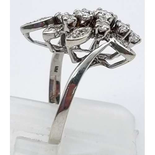 927 - An 18K White Gold Diamond Floral Ring. Size K. 1ct
5.2g total weight.