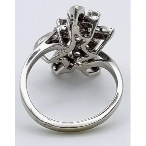 927 - An 18K White Gold Diamond Floral Ring. Size K. 1ct
5.2g total weight.