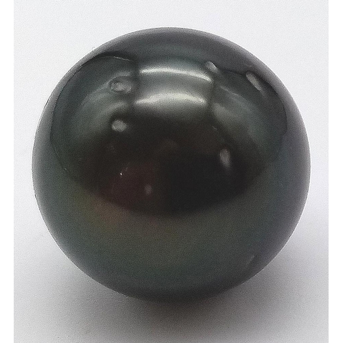 593 - A Large Natural Black Tahitian Pearl. 18mm. 6.61g