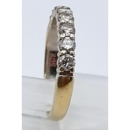 892 - An 18K Yellow Gold Diamond Half Eternity Ring. Eight diamonds - .8ct. Size O. 3.56g total weight.