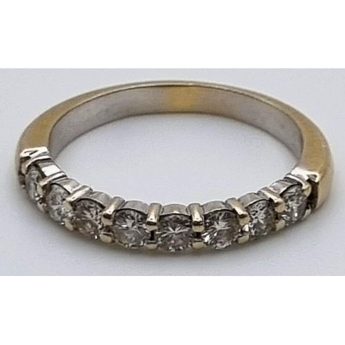 892 - An 18K Yellow Gold Diamond Half Eternity Ring. Eight diamonds - .8ct. Size O. 3.56g total weight.