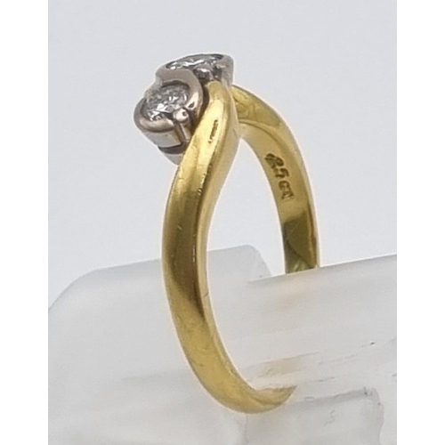 747 - An 18K Yellow Gold Two Diamond Crossover Ring. Size I.
3.12g.