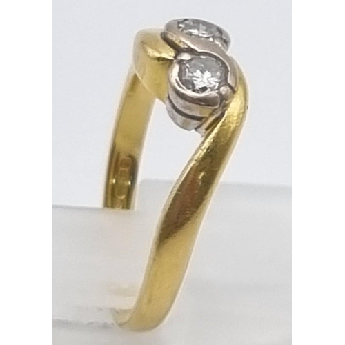 747 - An 18K Yellow Gold Two Diamond Crossover Ring. Size I.
3.12g.