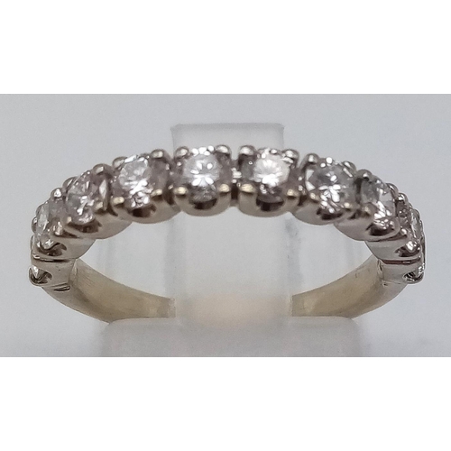 587 - An 18K White Gold Diamond Half-Eternity Ring. Ten dazzling diamonds - 1ct. Size J 1/2. 3g total weig... 