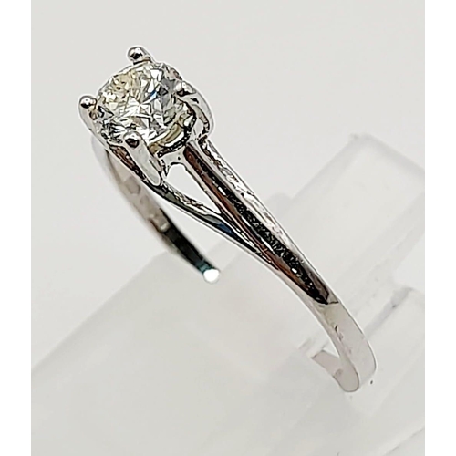 789 - An 18K White Gold Diamond Solitaire Ring. Size L.  0.35g. 2.07g.