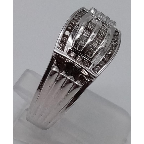 824 - A 14K White Gold Art Deco Style Diamond Dress Ring.
Twin row of baguette-cut diamonds surrounded by ... 