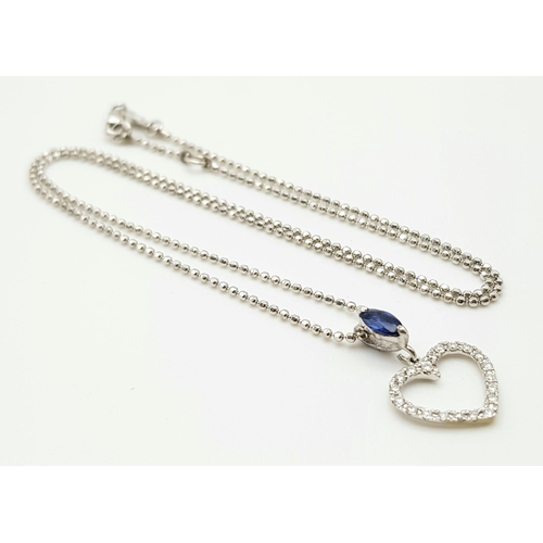 989 - An 18K White Gold Diamond and Sapphire Heart Pendant on an 18K White gold disappearing necklace. 18m... 