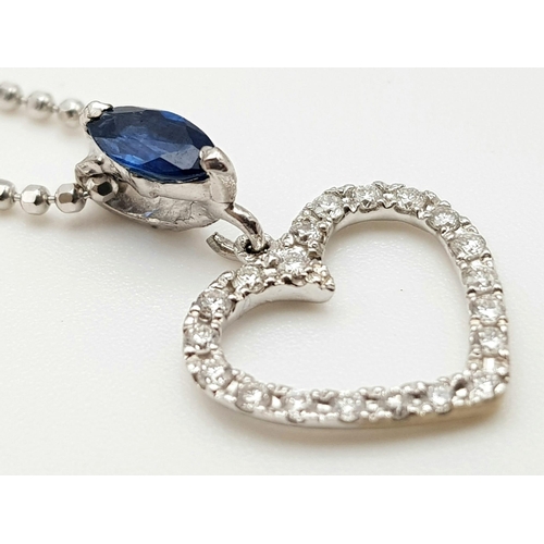 989 - An 18K White Gold Diamond and Sapphire Heart Pendant on an 18K White gold disappearing necklace. 18m... 