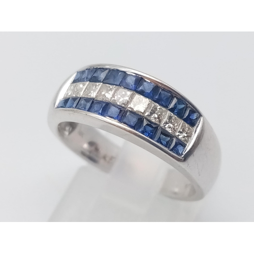 1003 - An 18K White Gold Sapphire and Diamond Three-Row Ring. Nine diamonds -0.5ct, sandwiched in-between 1... 