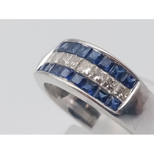 1003 - An 18K White Gold Sapphire and Diamond Three-Row Ring. Nine diamonds -0.5ct, sandwiched in-between 1... 