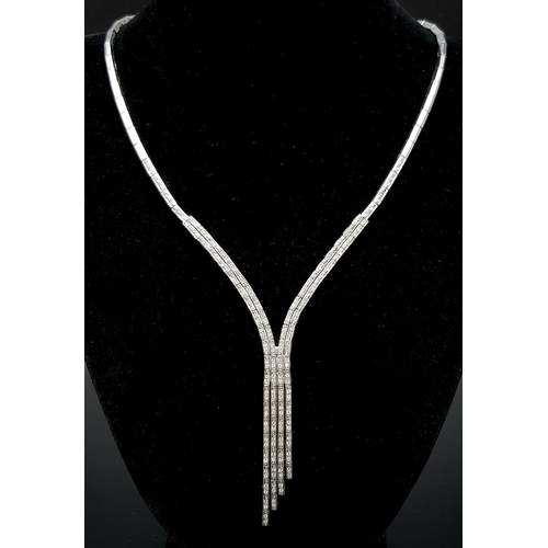 1024 - A Vintage 18K White Gold Diamond Tassel Necklace. Bar links leading to diamond bar links and finally... 