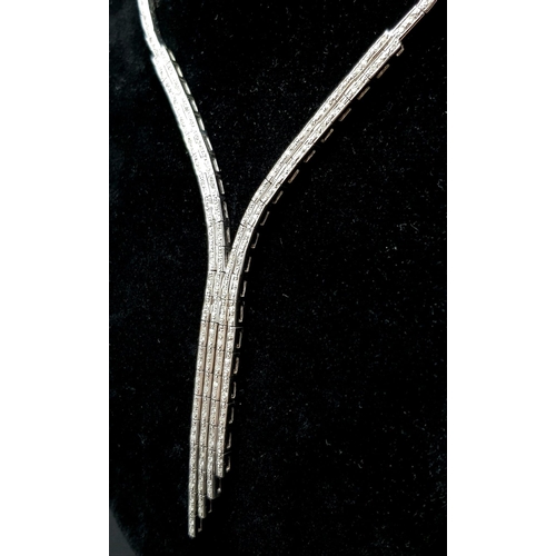 1024 - A Vintage 18K White Gold Diamond Tassel Necklace. Bar links leading to diamond bar links and finally... 