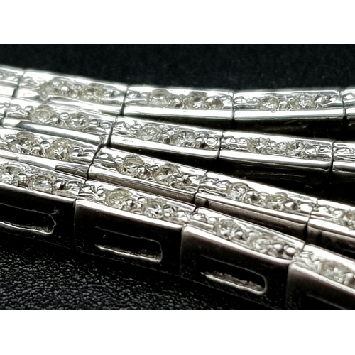 1024 - A Vintage 18K White Gold Diamond Tassel Necklace. Bar links leading to diamond bar links and finally... 