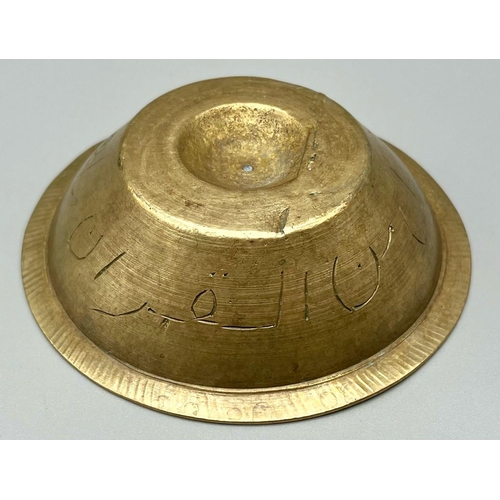 523 - An Early Persian Islamic Small Copper Holy Bowl - Engraved with calligraphy. 3.5cm x 12cm diameter.