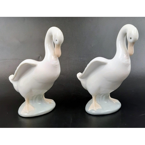 814 - Seven Nao Duck Figurines and One Lladro. 16cm tallest piece.