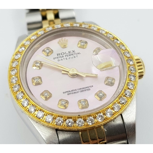 150 - LADIES ROLEX OYSTER PERPETUAL DATEJUST WITH DIAMOND BEZEL AND NUMERALS AND PINK FACE.  
Come with bo... 