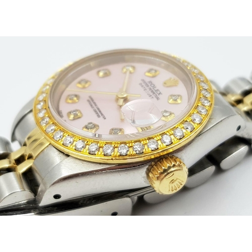 150 - LADIES ROLEX OYSTER PERPETUAL DATEJUST WITH DIAMOND BEZEL AND NUMERALS AND PINK FACE.  
Come with bo... 