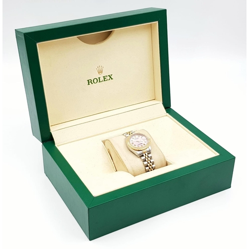 150 - LADIES ROLEX OYSTER PERPETUAL DATEJUST WITH DIAMOND BEZEL AND NUMERALS AND PINK FACE.  
Come with bo... 