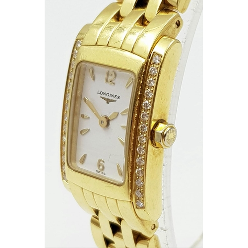 242 - LADIES 18K GOLD LONGINE WATCH WITH 18K GOLD STRAP AND DIAMOND BEZEL.  WITH BOX AND PAPERS  16 X 24mm... 